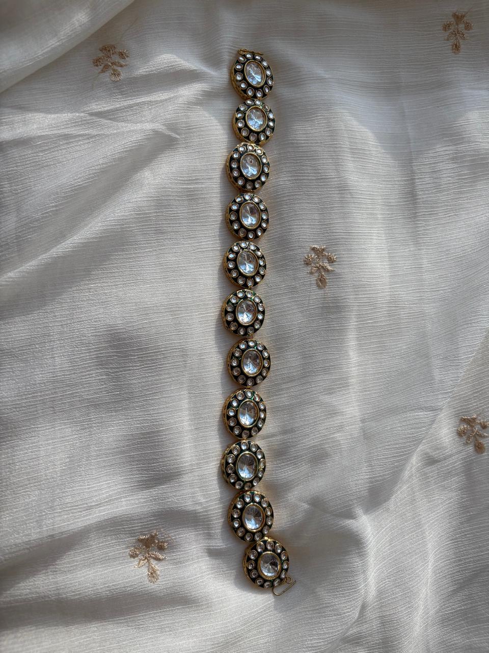 Sheesh phool (hair accessory)with pachi kundans and green enamel.
