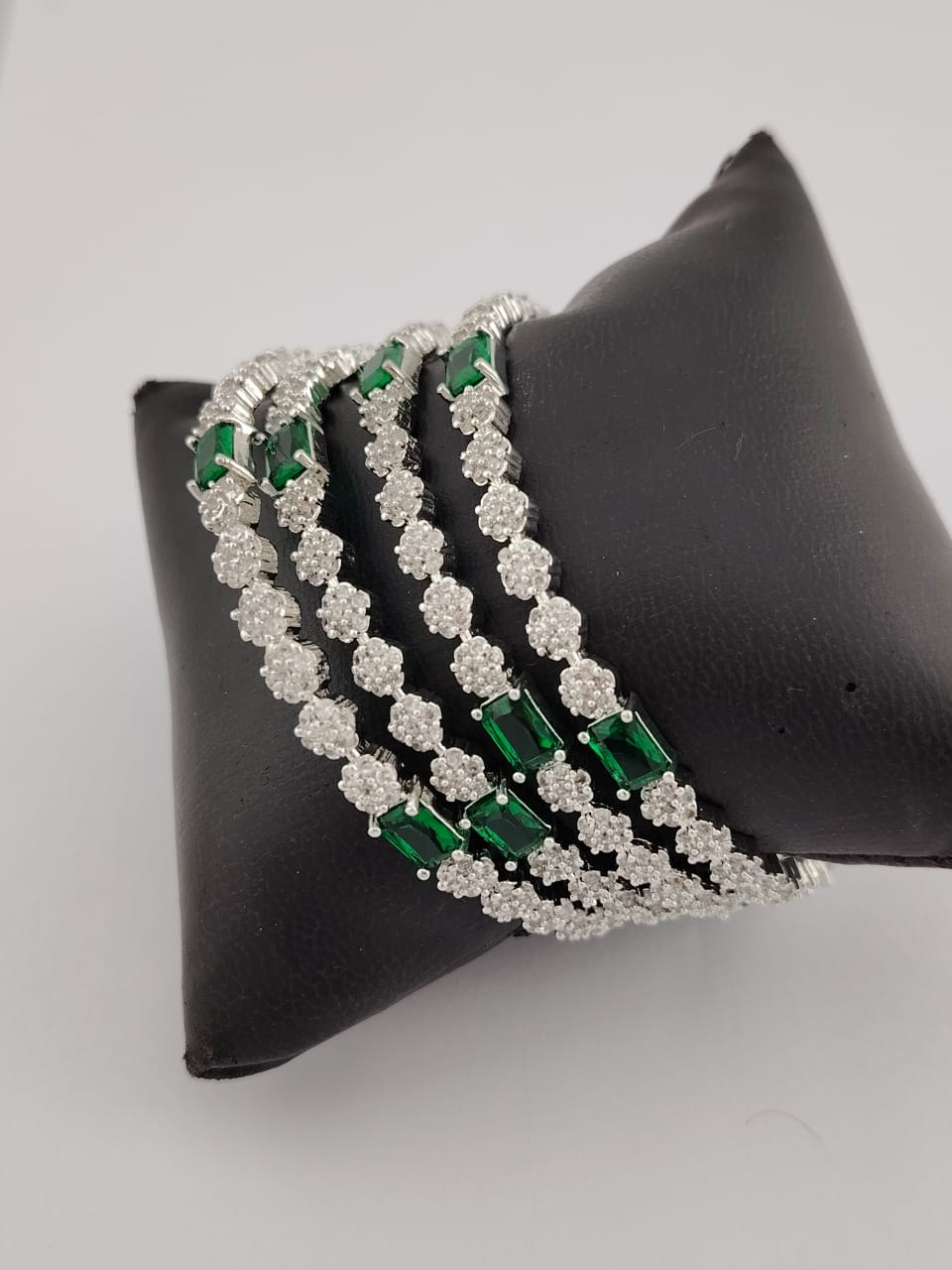 Rhodium polished american diamond and green CZ stones bangles - set of 4 pcs