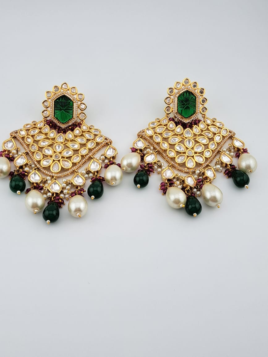 Bridal kundan earrings with carved green stones and dual drop hangings in pearls and emerald
