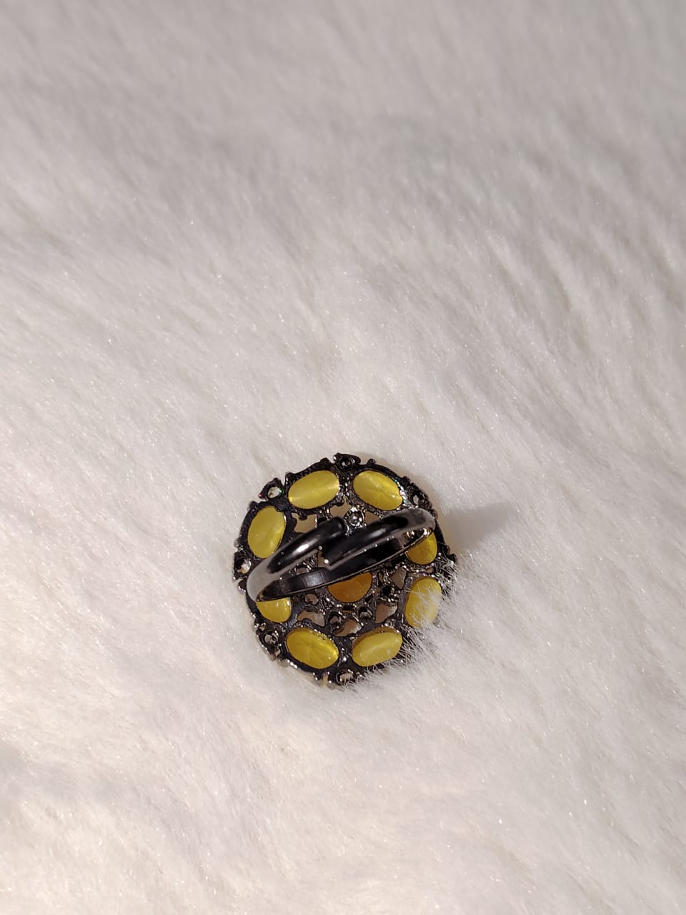 German silver oxidized finger ring with mustard and white zircons.