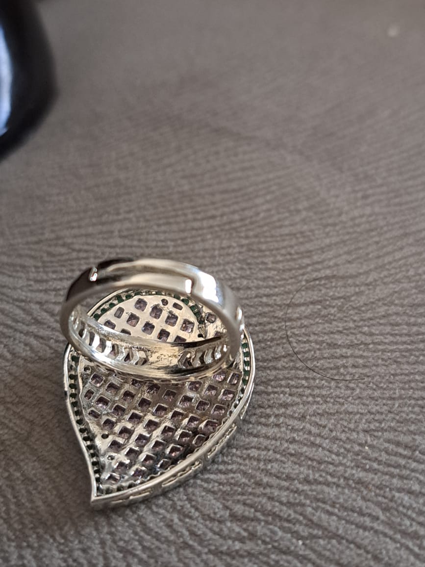 Swarovski silver finger ring with pink and mint green stones.