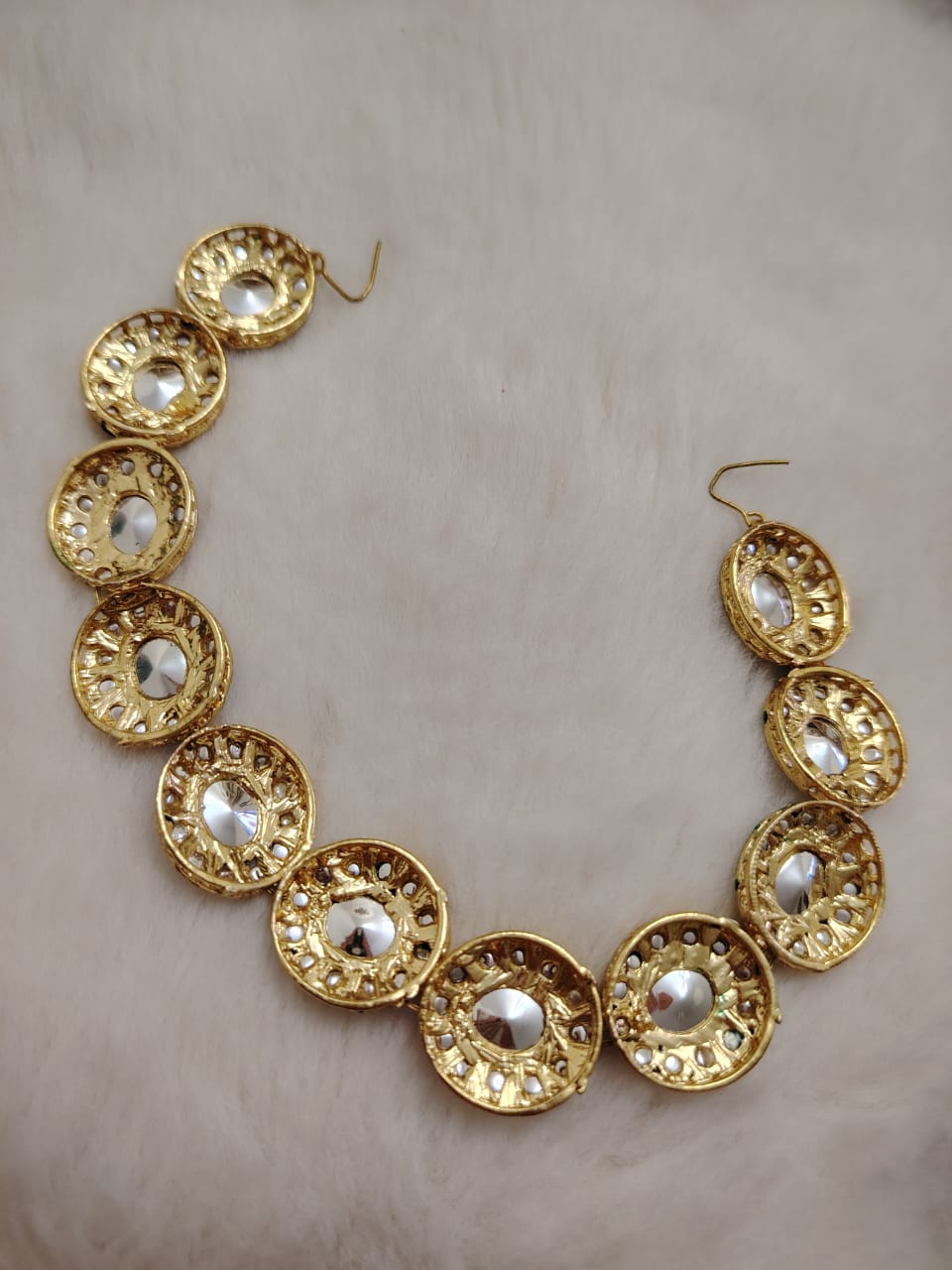 Sheesh phool (hair accessory)with pachi kundans and green enamel.