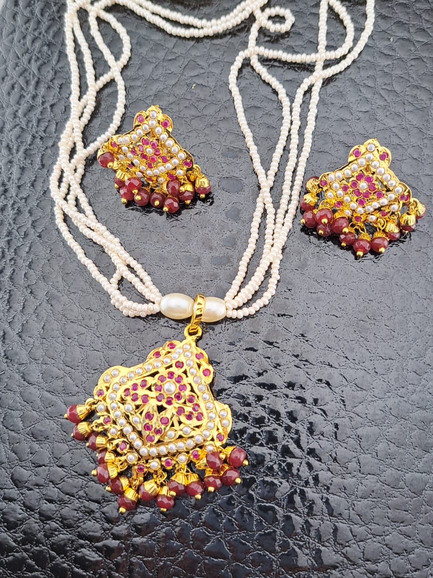 Hyderabadi pearl necklace set with ruby pendant and studs