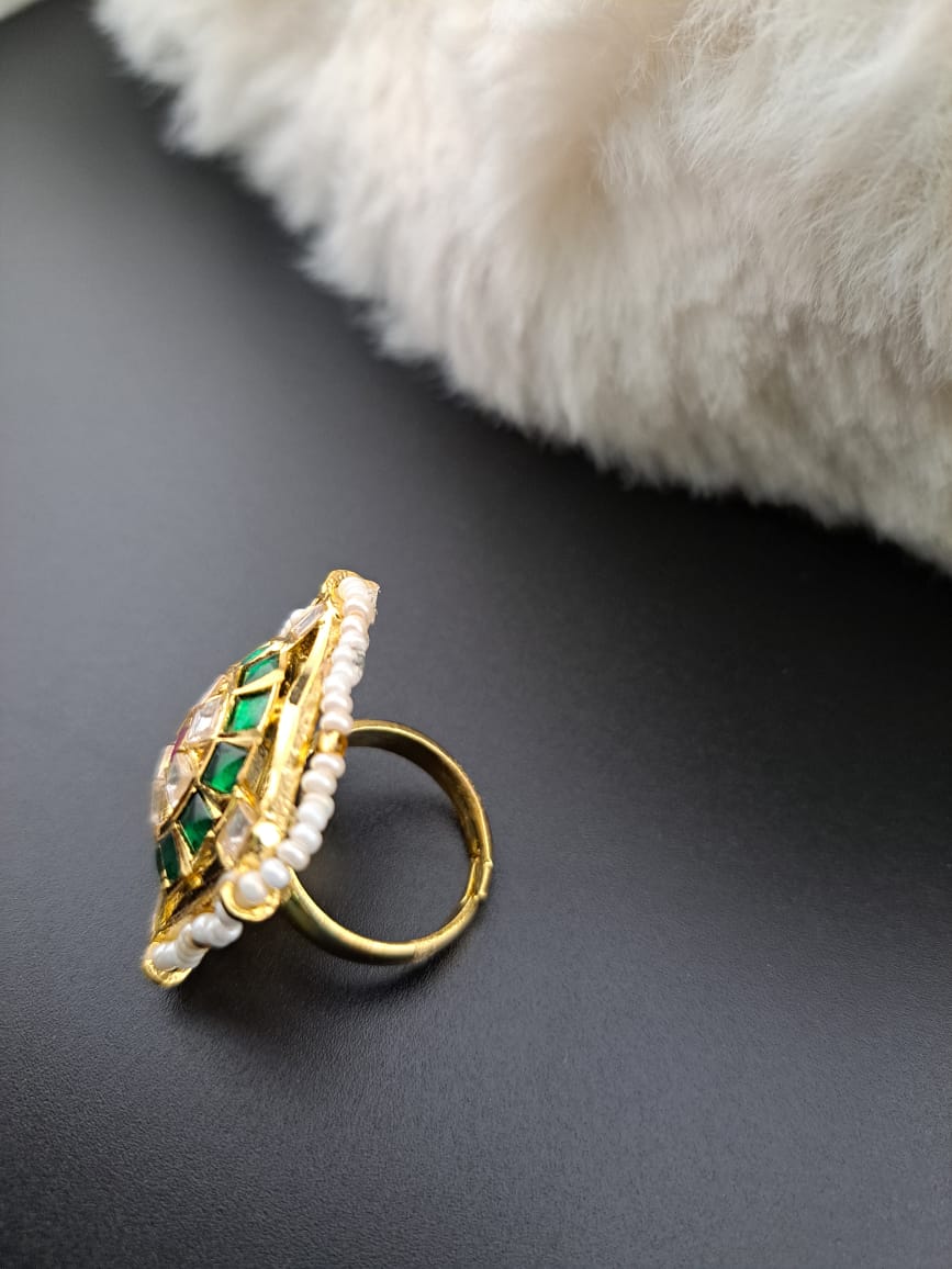 Pachi kundan finger ring with kemp stones and pearls.