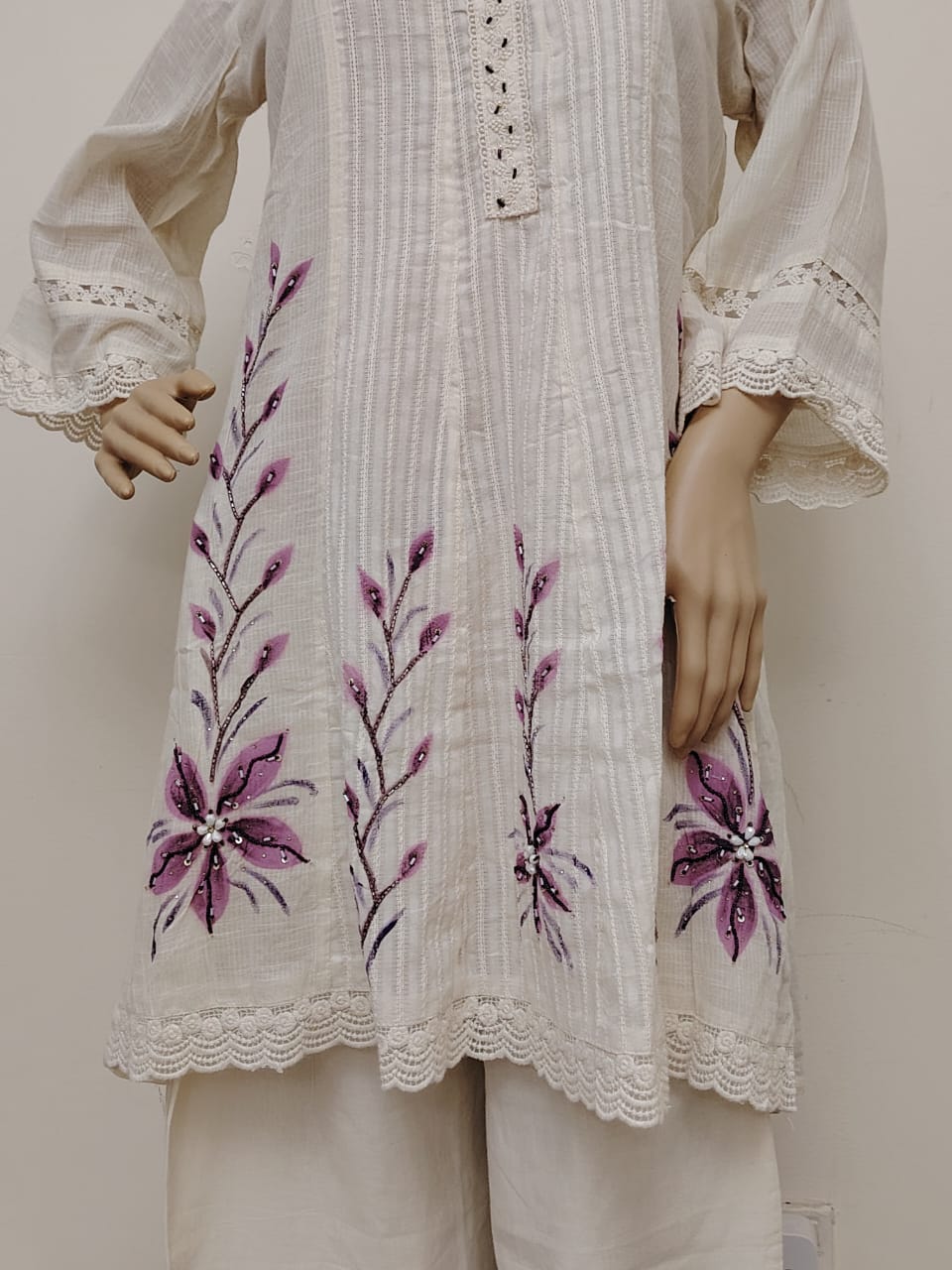 Off-white kora cotton short kurti and pant set with brush paint and dyed dupatta.