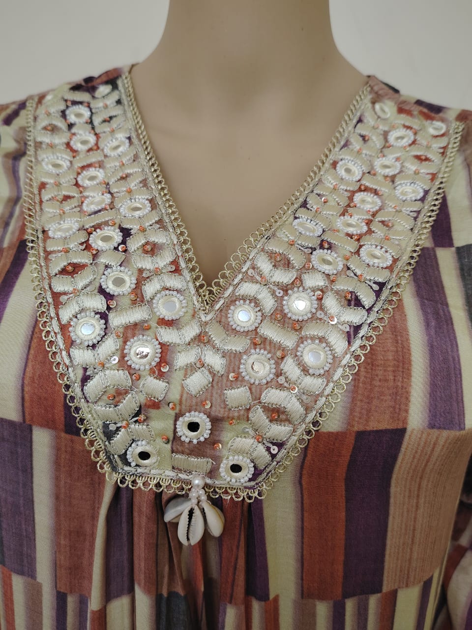 Pure muslin silk salwar kameez in peach mauve shades.