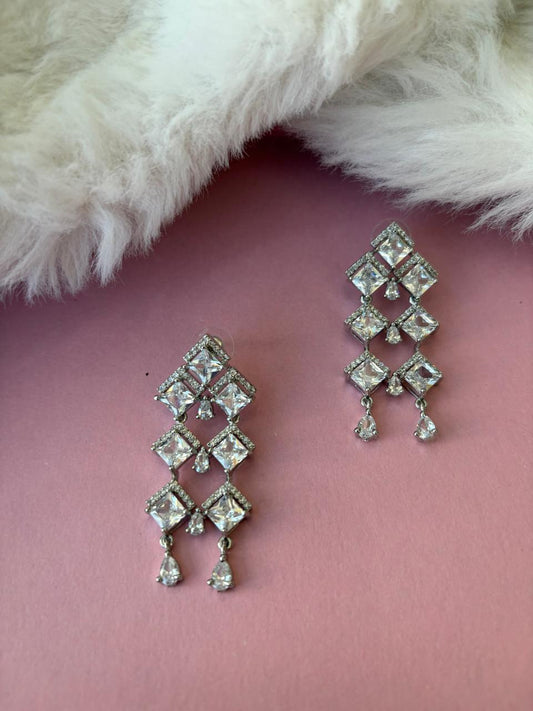 Silver danglers with american diamonds and cubic zirconia.