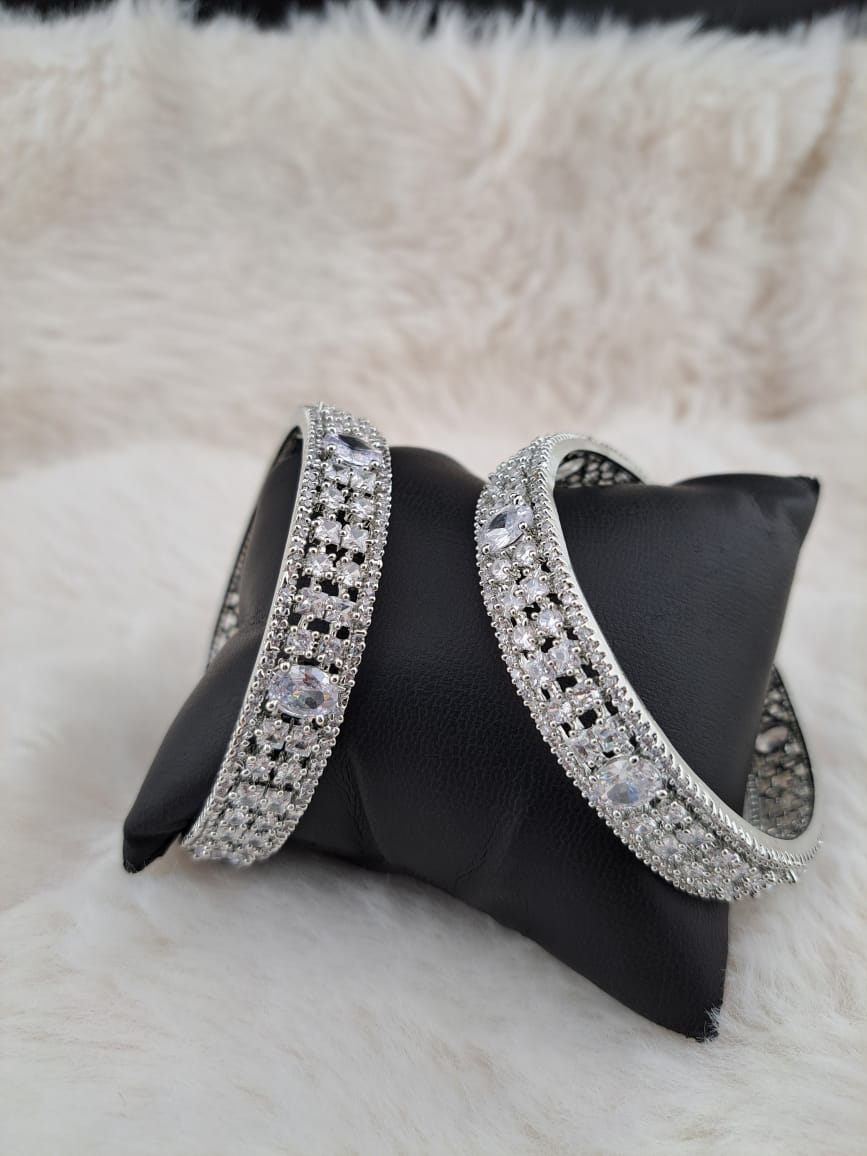 Gorgeous American diamonds and cubic zircon silver bangles.