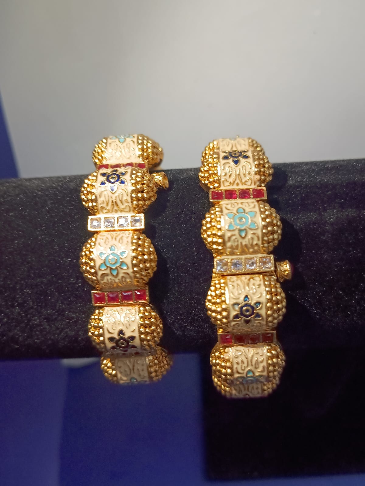 Rajwadi meena bangles with ruby and CZ stones.