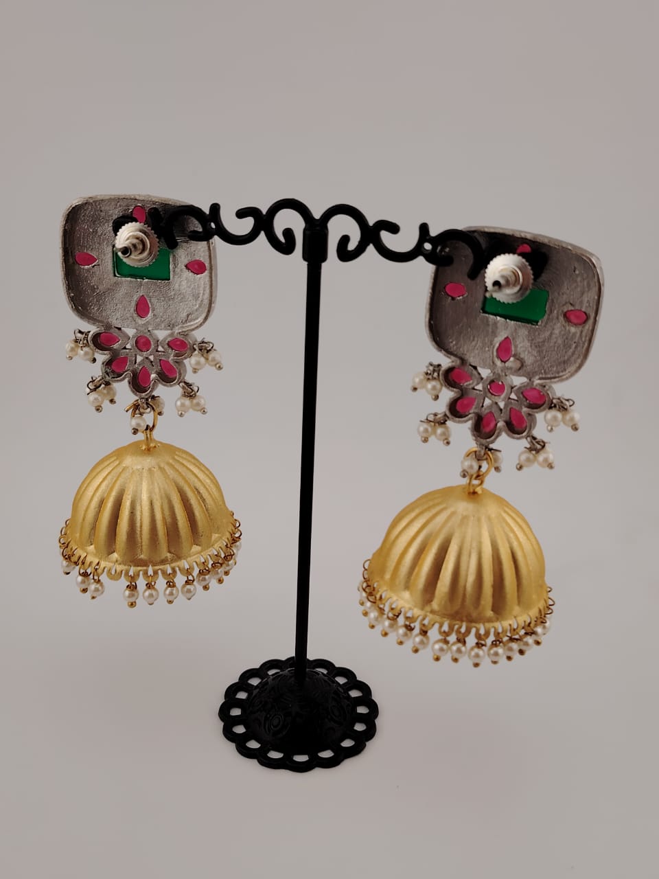 Two tone jhumkas with ruby and emerald stones