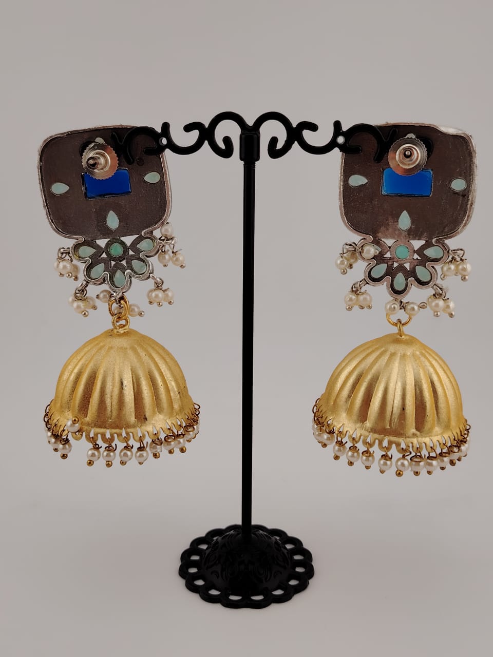 Two tone jhumkas with blue pota stones.