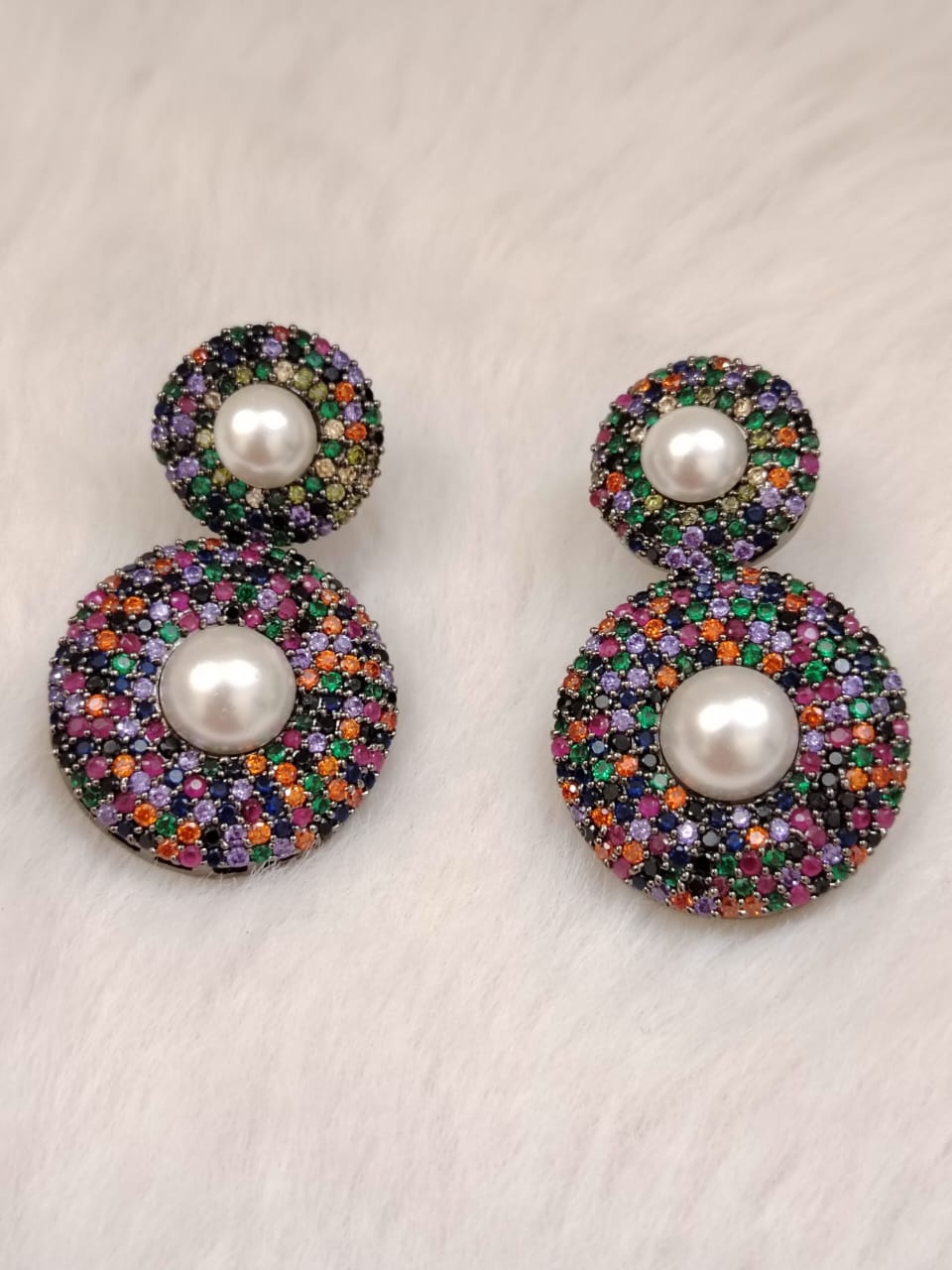 Sabyasachi inspired earrings studded with multicolor stones and pearls