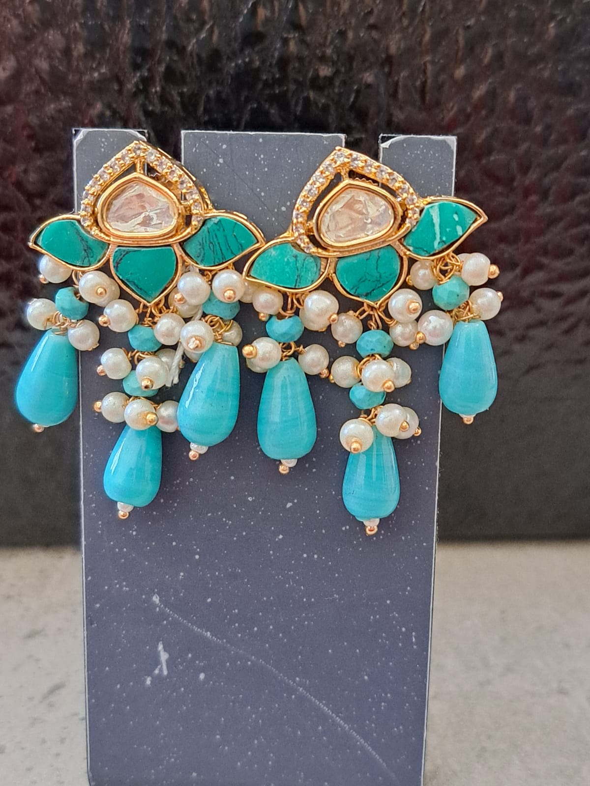 Kundan studs with turquoise marble, beads and pearls.