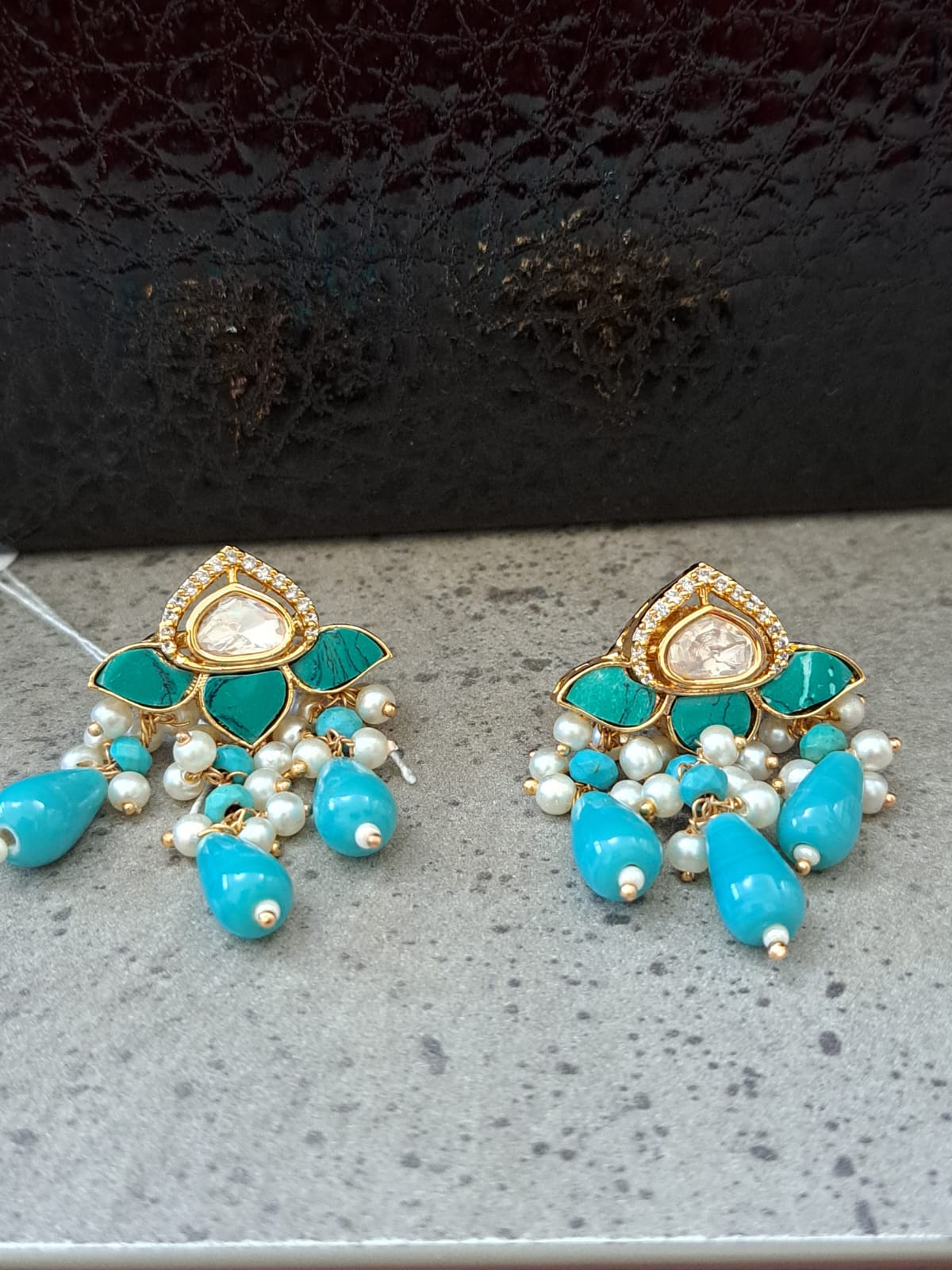 Kundan studs with turquoise marble, beads and pearls.