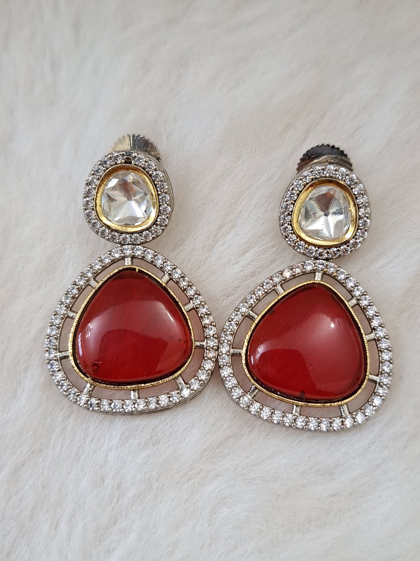 Kundan earrings with red duplet stone.