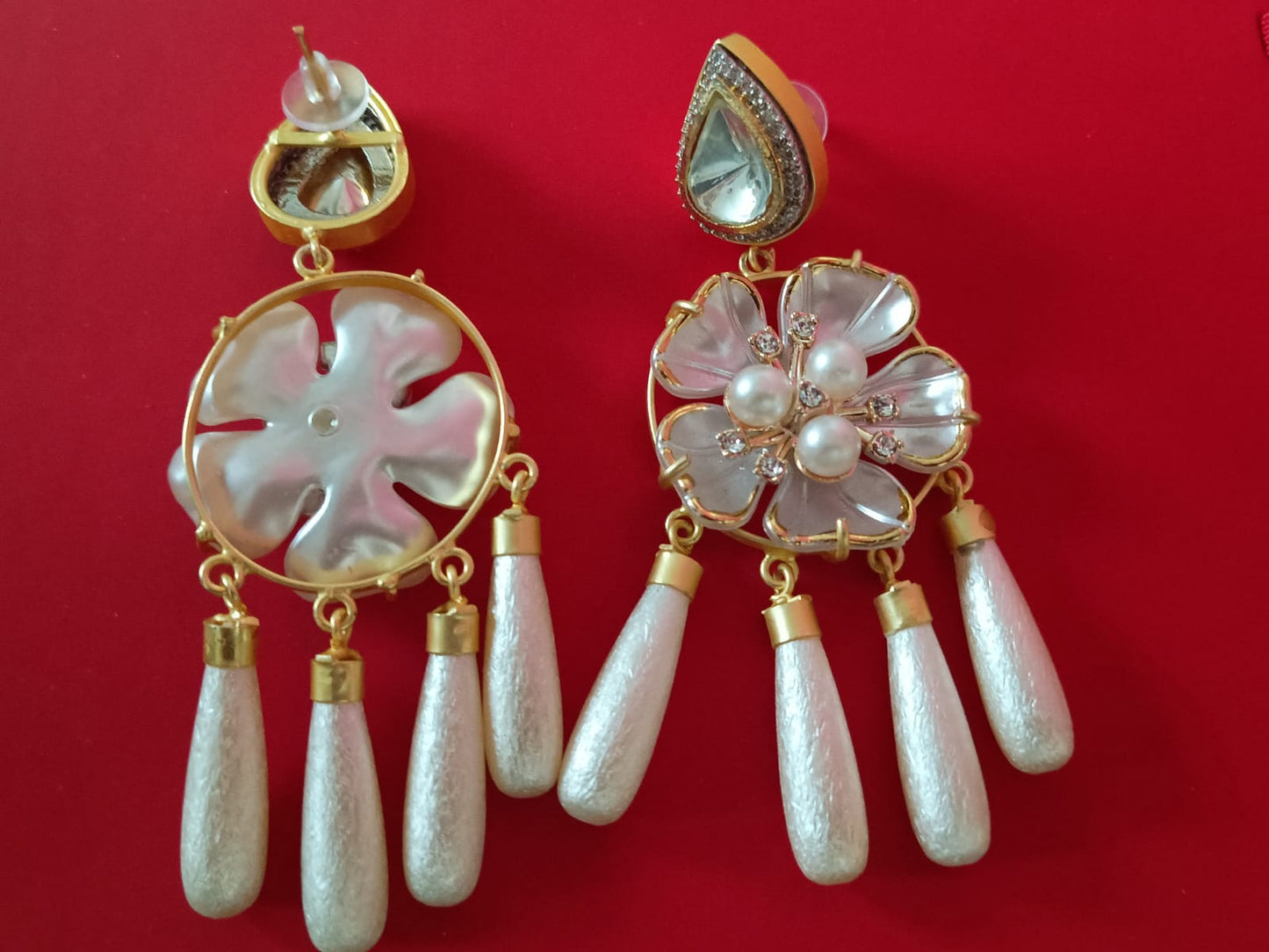 Mother of pearl danglings with kundan and american diamonds
