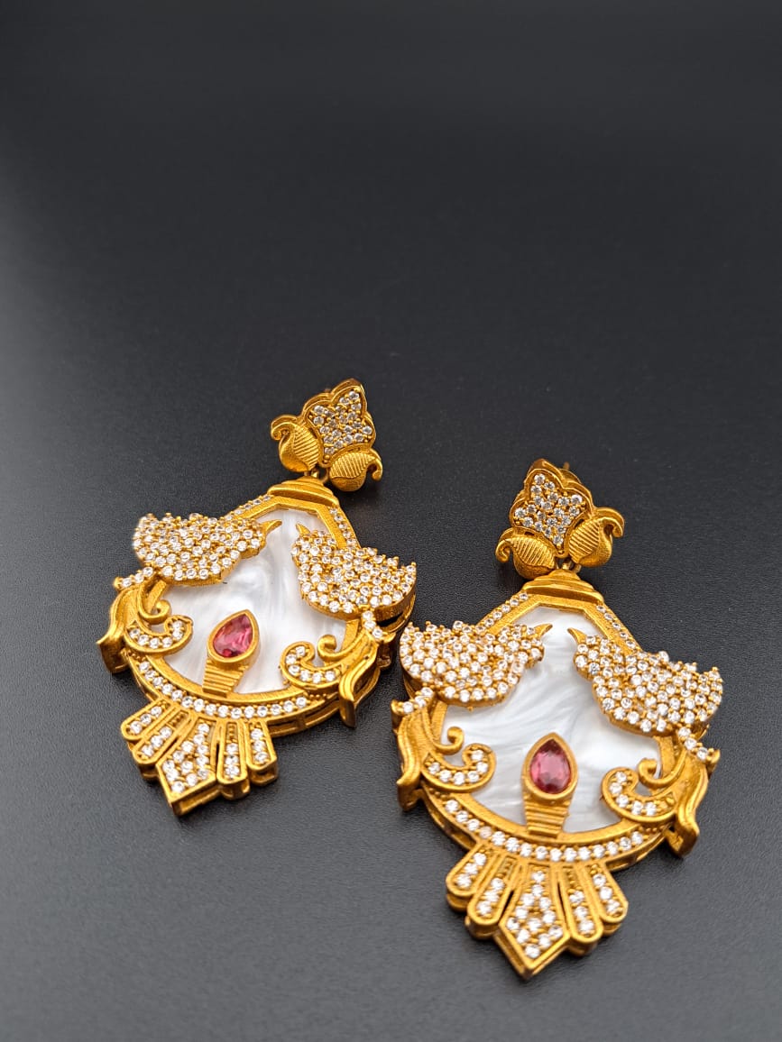Antique mother of peal earrings with american diamonds and ruby stone