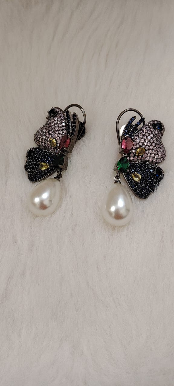 Beautiful butterfly earrings in blue and pink AD stones with pearl drops