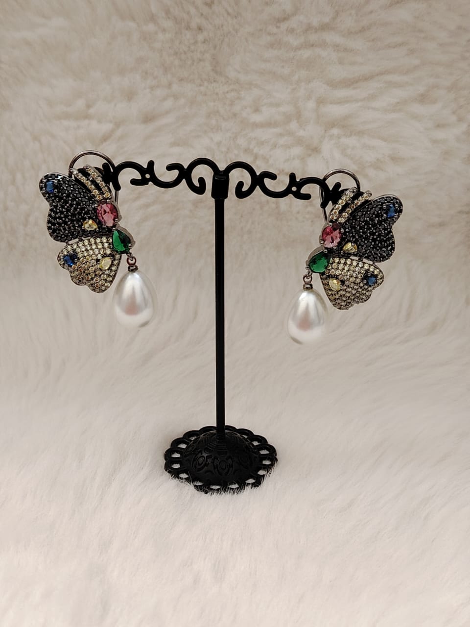 Beautiful butterfly earrings in blue and lime AD stones and pearl drop