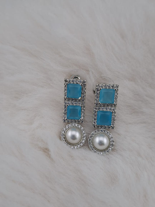 Light blue zircon stone earrings with american diamonds and pearl.