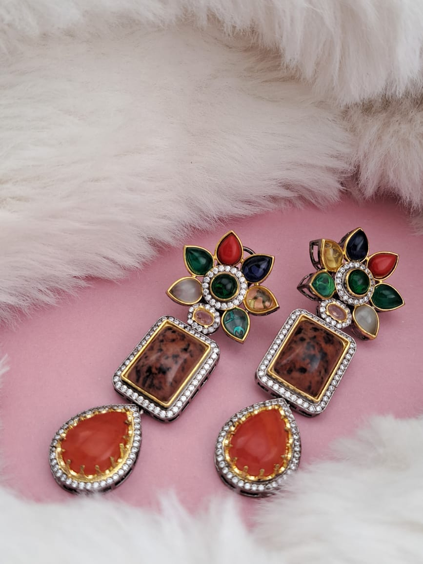 Swarovski danglers with multi-color semi-precious stones and american diamonds.