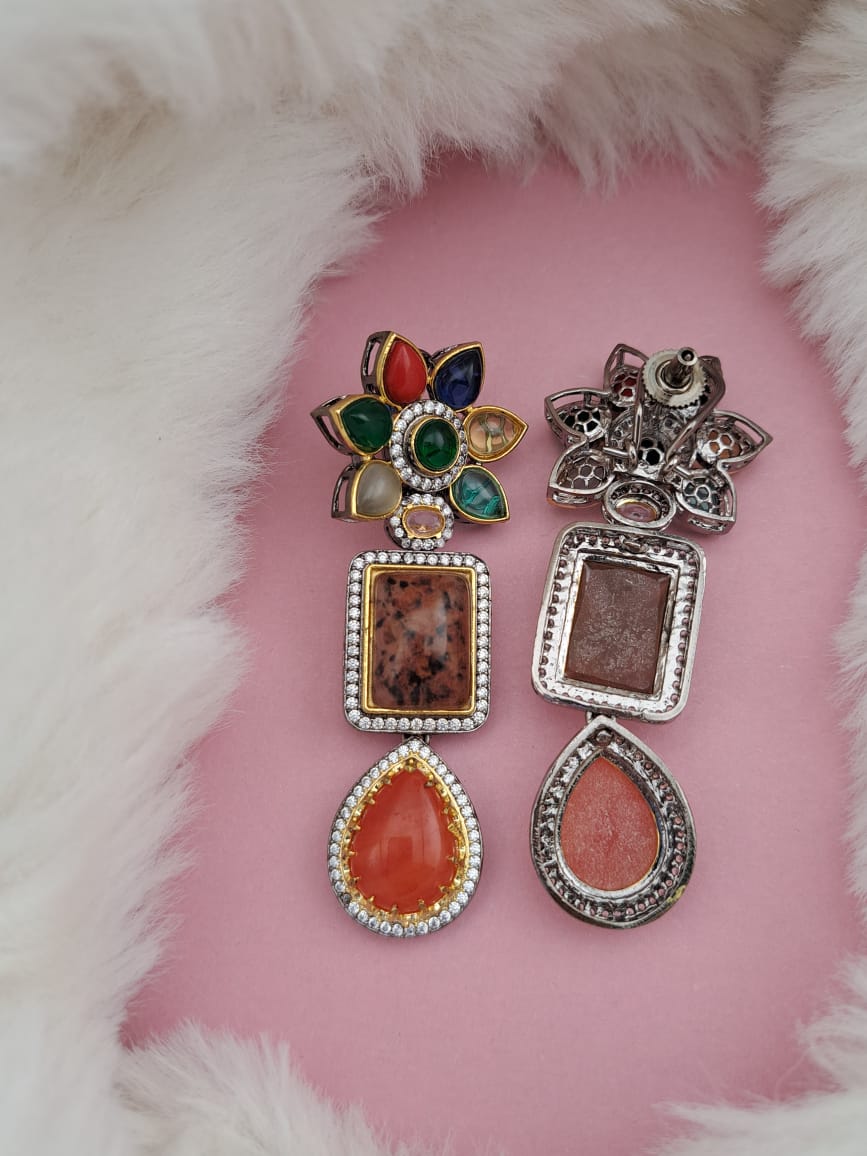 Swarovski danglers with multi-color semi-precious stones and american diamonds.