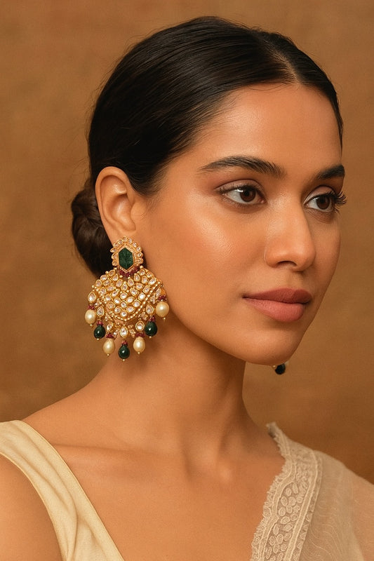 Bridal kundan earrings with carved green stones and dual drop hangings in pearls and emerald