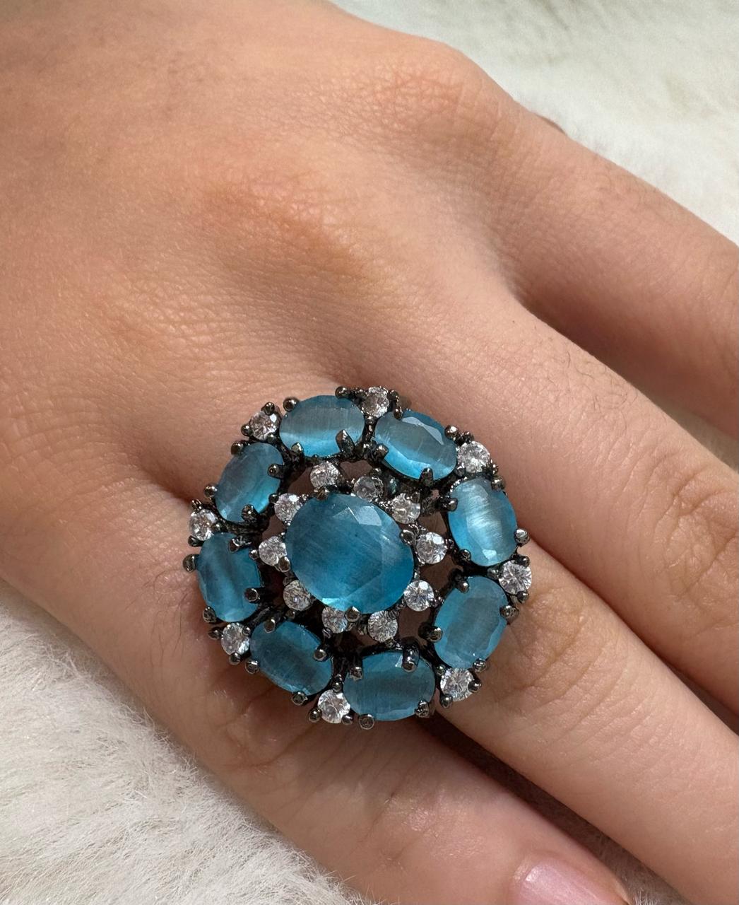 German silver oxidized finger ring with light blue and white zircons