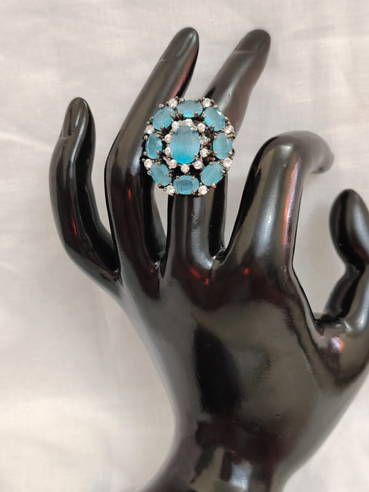 German silver oxidized finger ring with light blue and white zircons