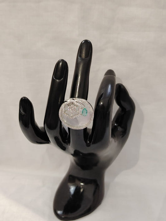 Mother of pearl finger ring with blue zircon and american diamonds in silver