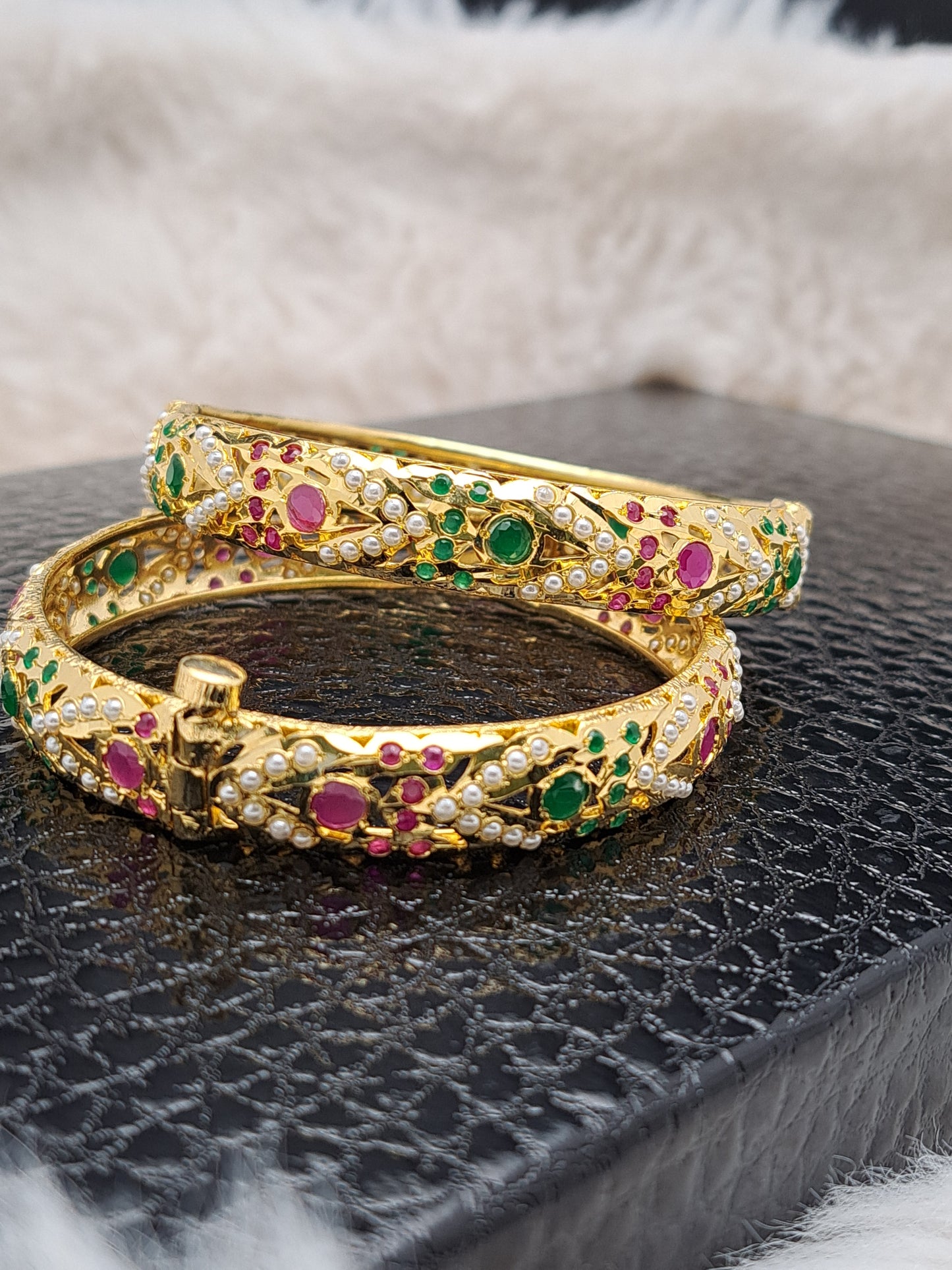 Hyderabadi openable bangles with ruby ,emerald and pearls.