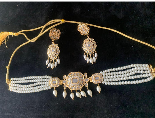 Jadau gold choker with pearls and  polki stones.