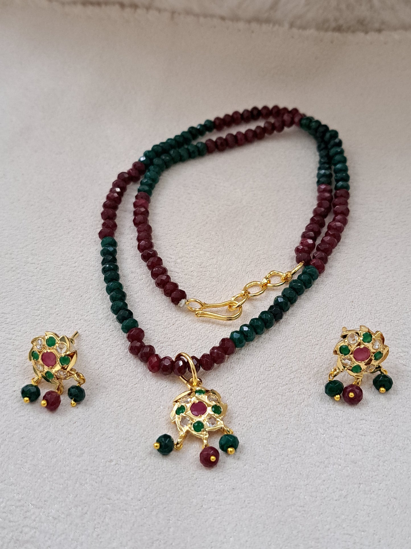 Real onyx beads set with ruby,emerald and polki kundans.