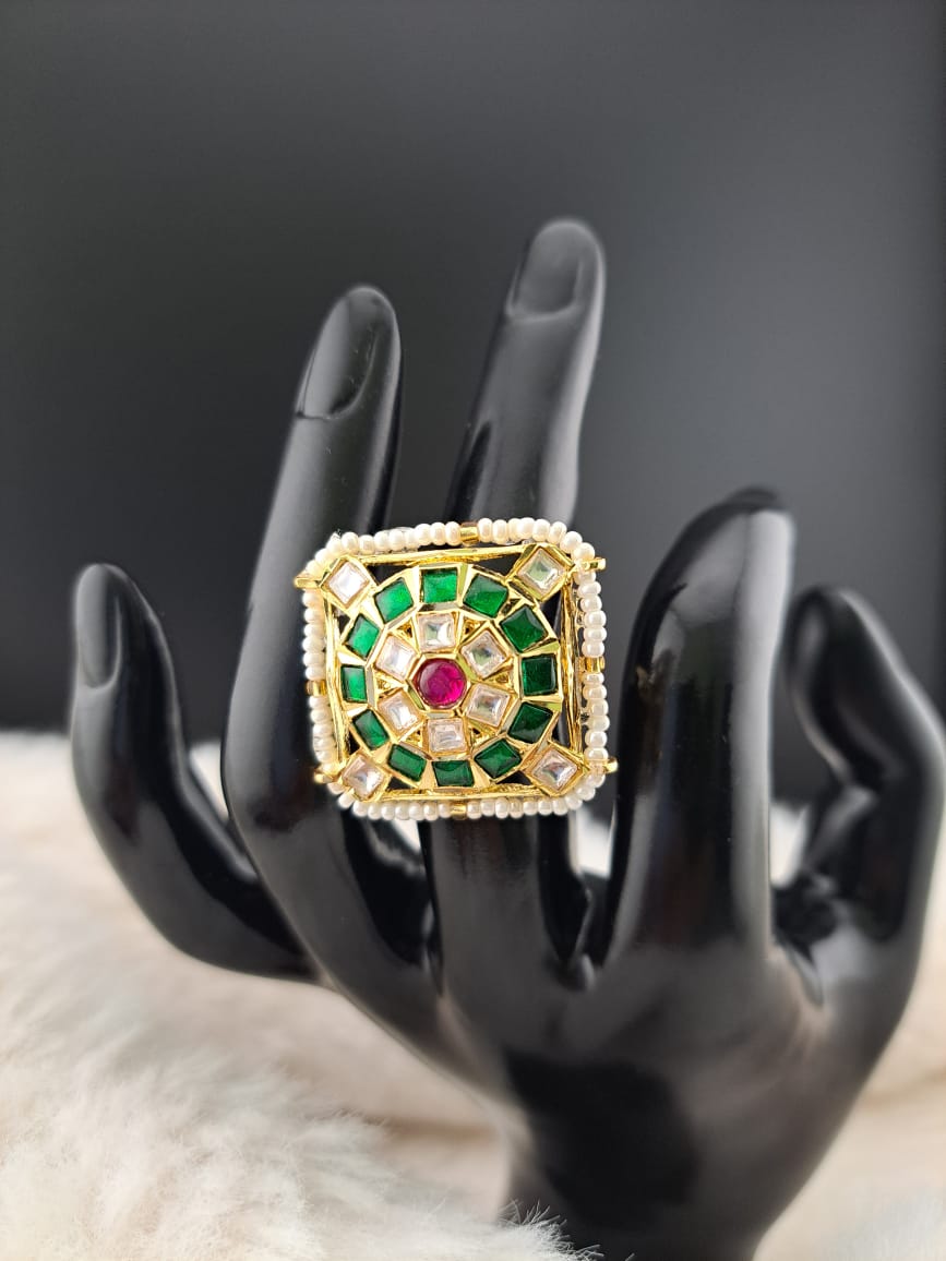 Pachi kundan finger ring with kemp stones and pearls.