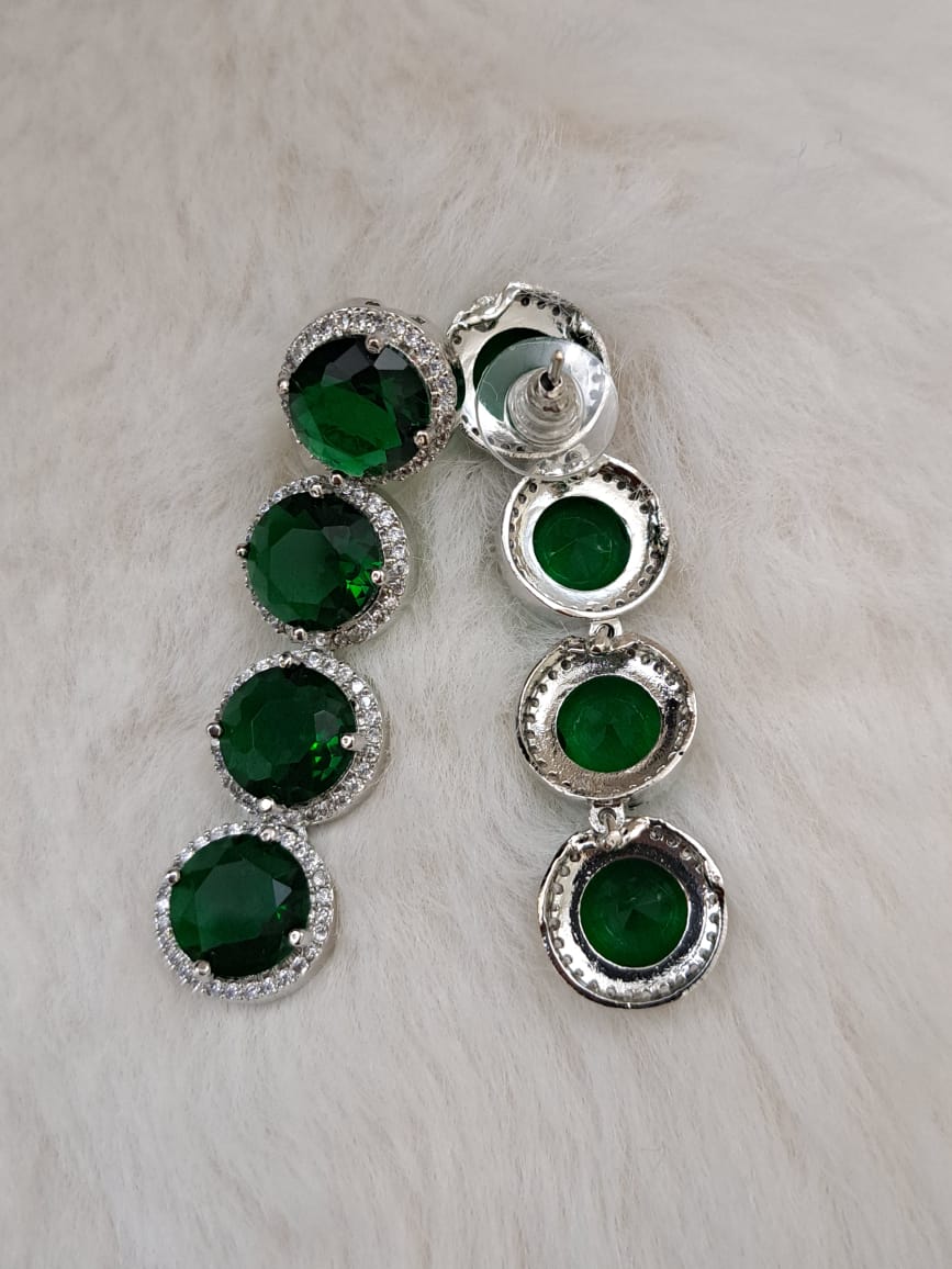 Gorgeous bottle green cubic zircon stones and american diamond set .