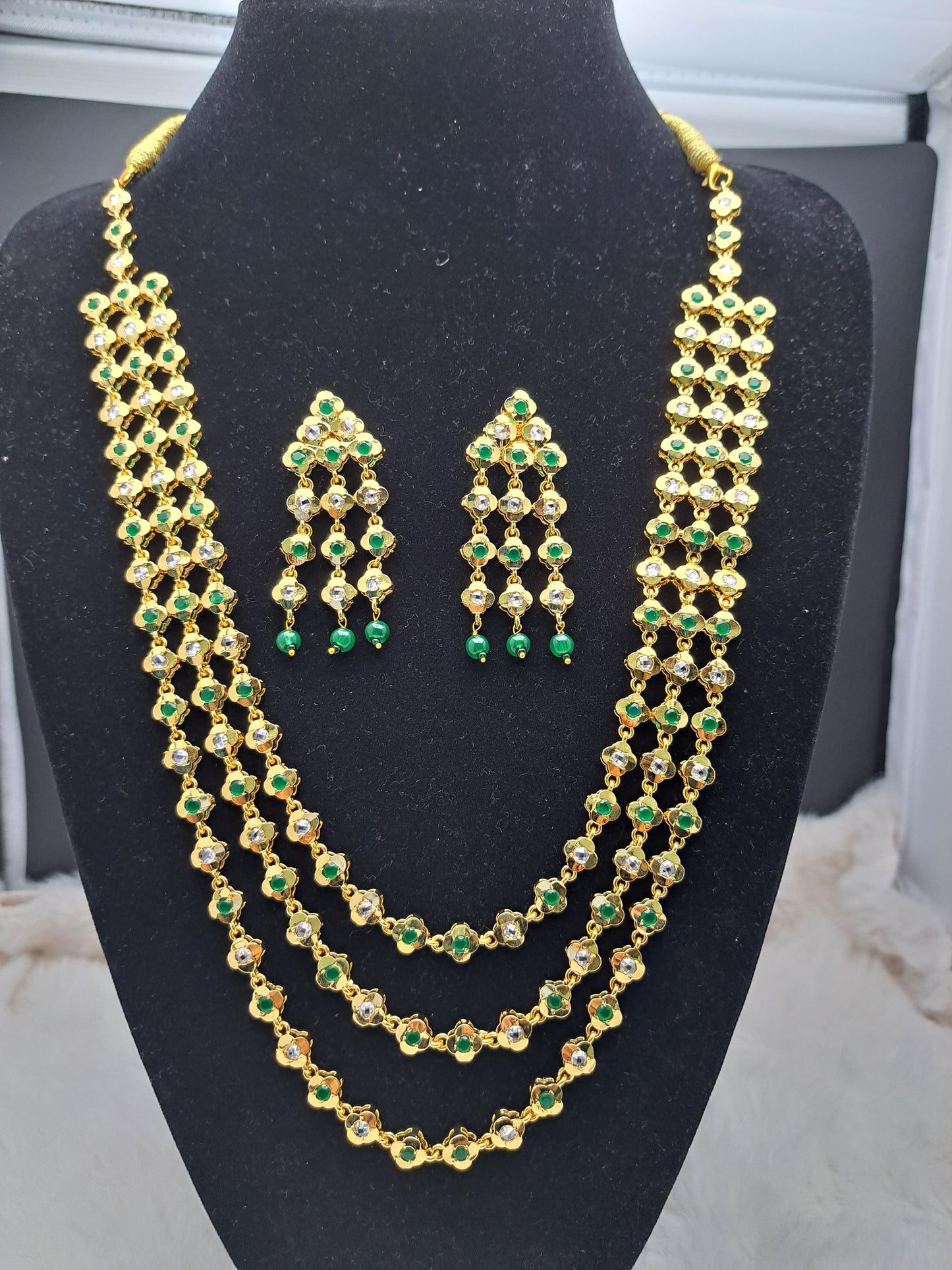 Uncut polki kundan and emerald  multi-layered haar with earrings