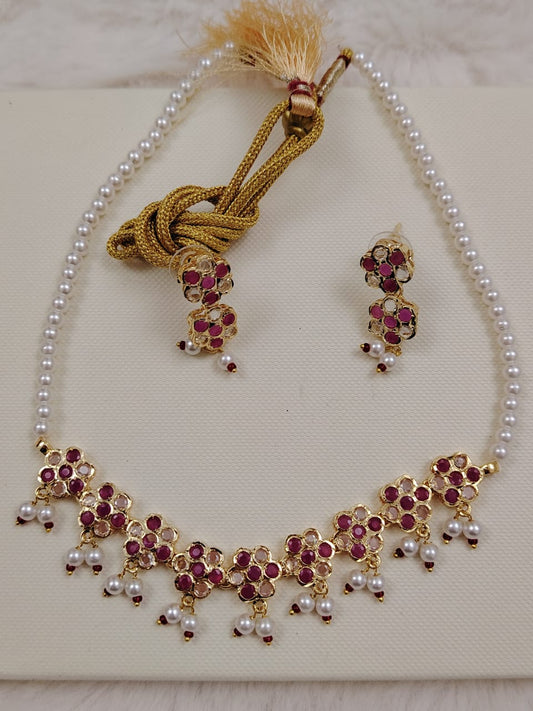 Semi-precious  pearl set with ruby and polki stones