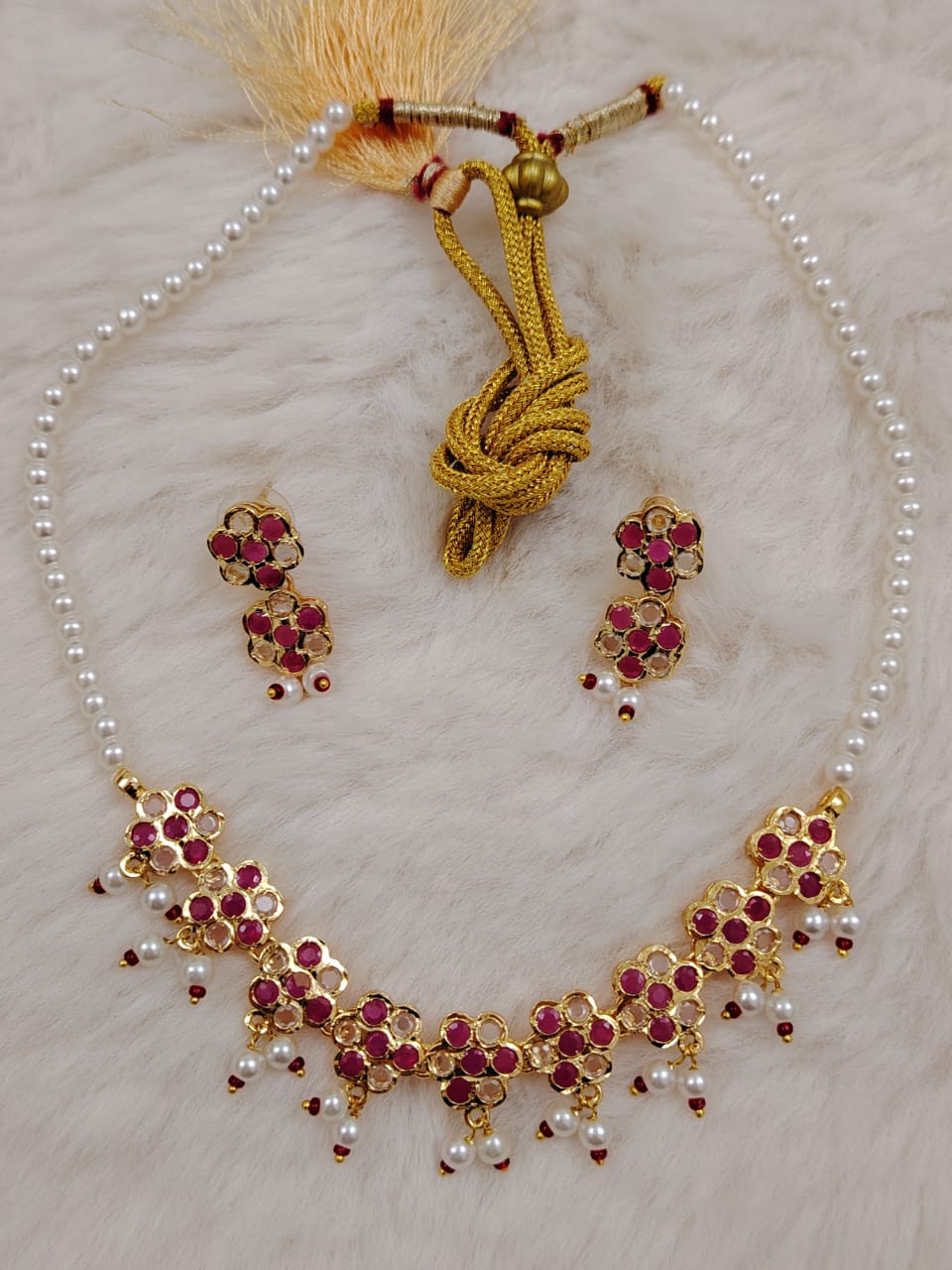 Semi-precious pearl set with ruby and polki stones