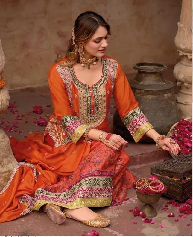 Orange color sharara set with digital prints and aari embroidery.