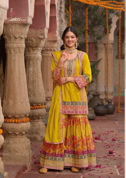 Mustard yellow sharara set with digital prints and aari embroidery.
