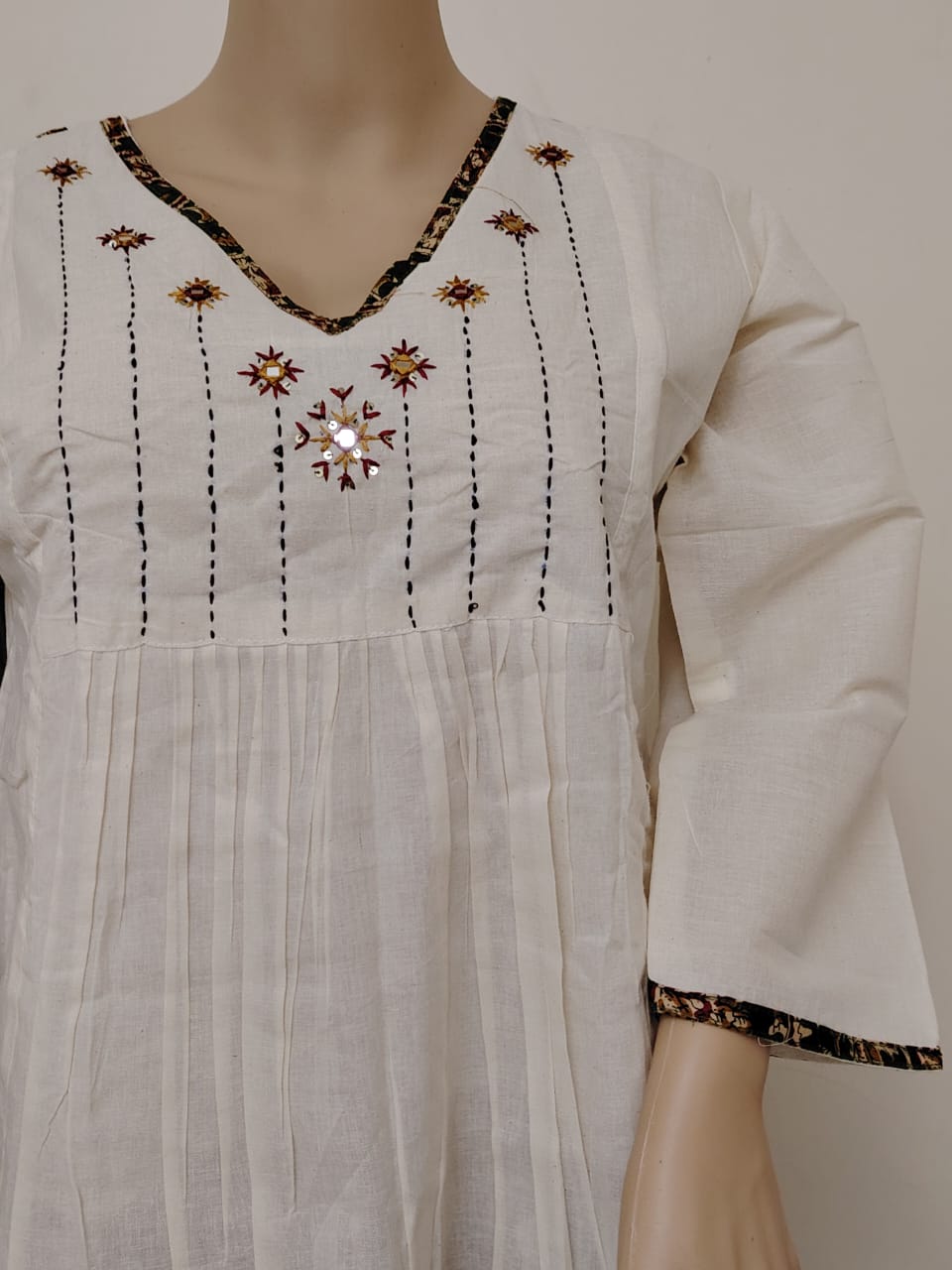 Offwhite kora cotton kurta paired with ajrakh palazzo and mul cotton dyed aplique dupatta